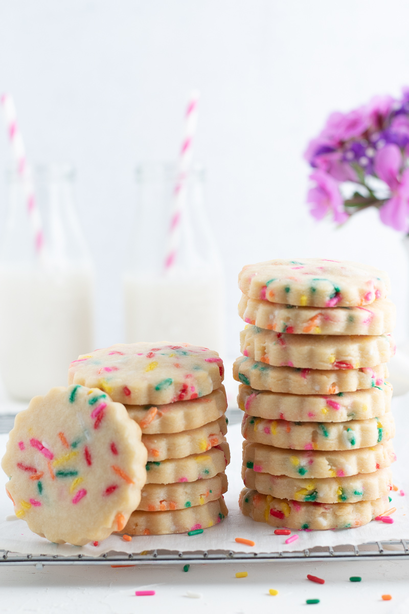 2 stacks of cookies with 2 glasses of milk