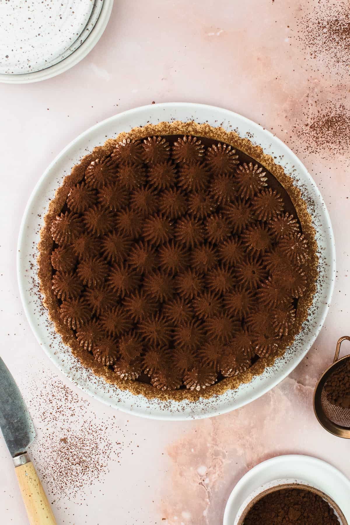 Cocoa dusted tiramisu tart on a plate