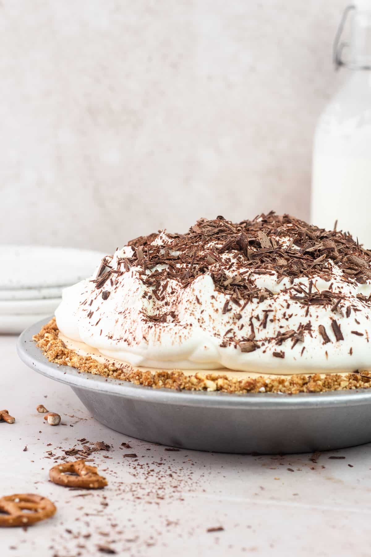 Peanut Butter Pretzel Pie with milk bottle in the back