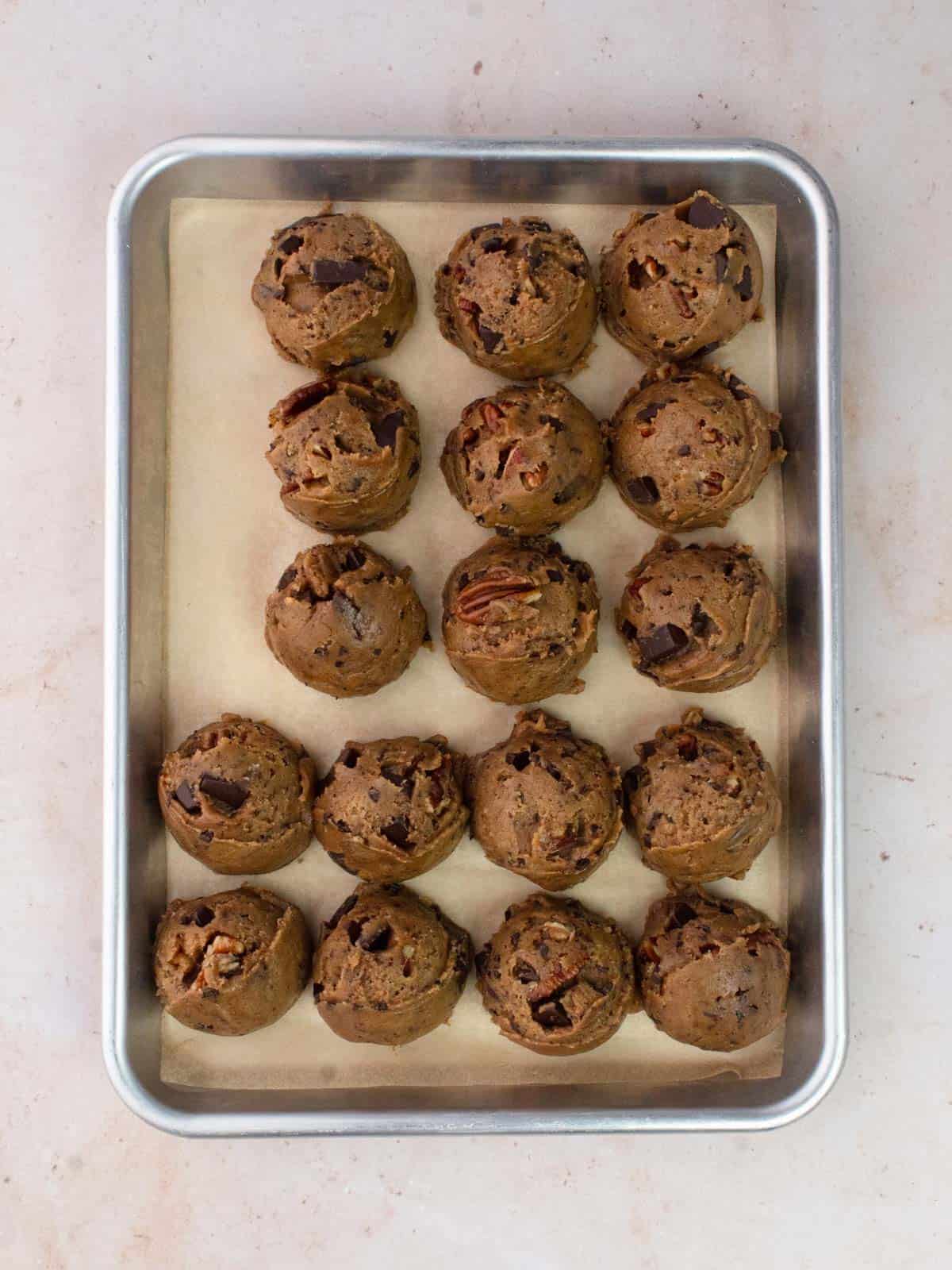 Scoops of cookie dough on baking tray