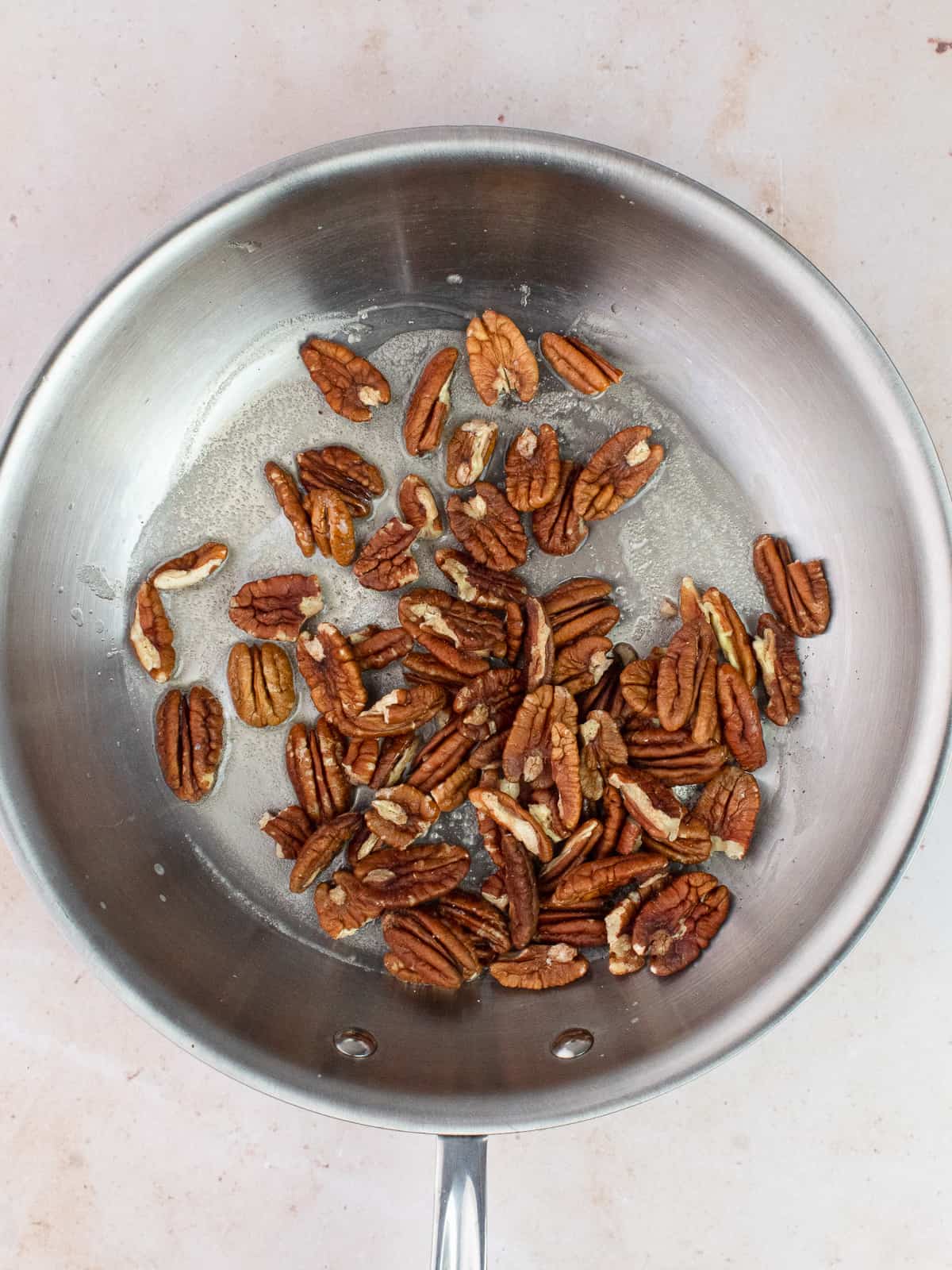 Butter and pecans in a pan