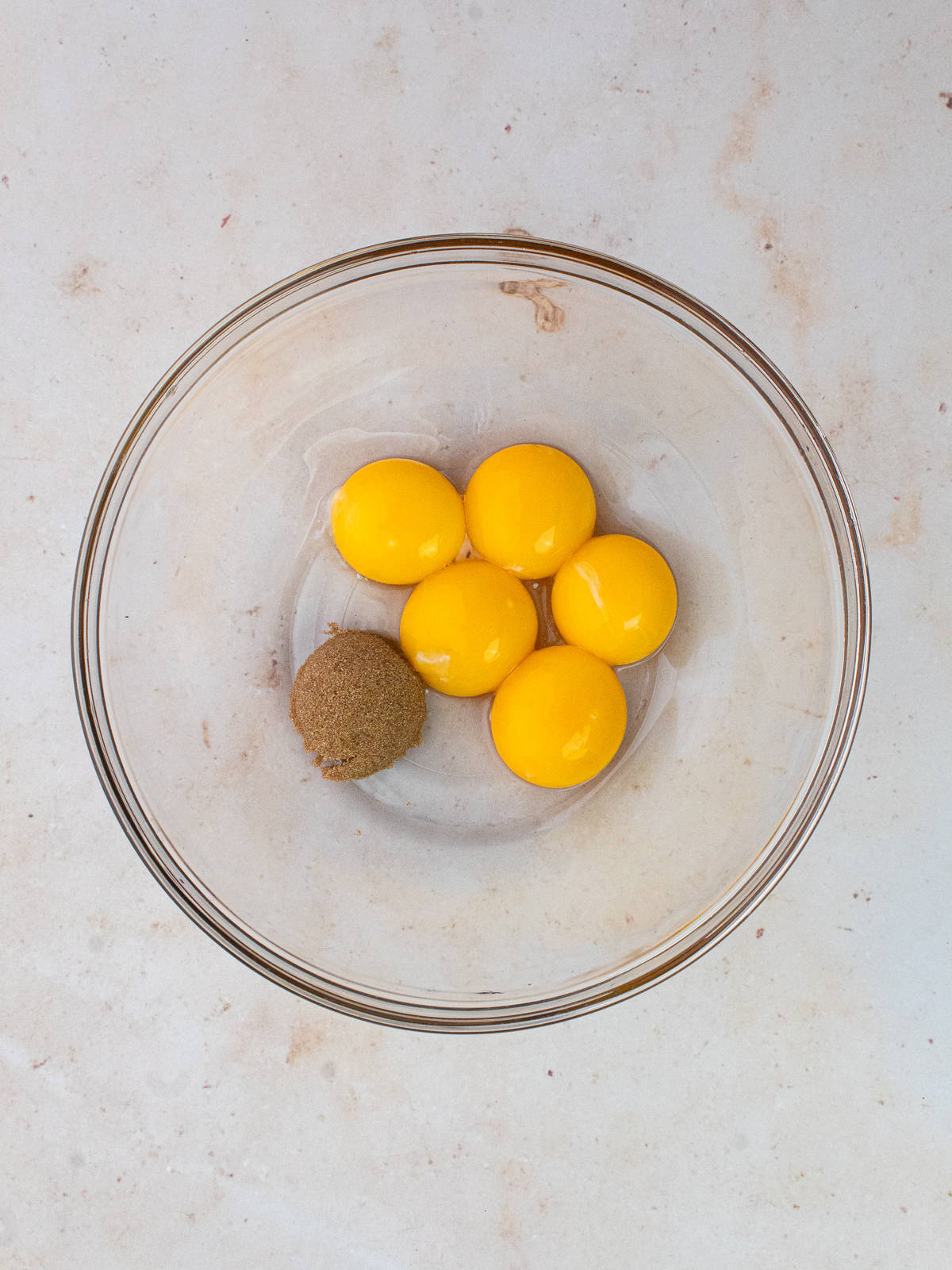 egg yolks and brown sugar in bowl