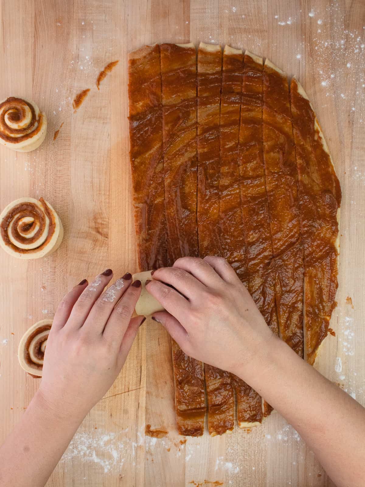 Strips of dough are cut and rolled