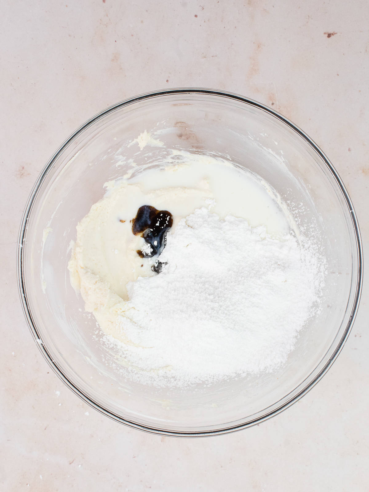 Bowl of brown butter, cream cheese, powdered sugar and vanilla