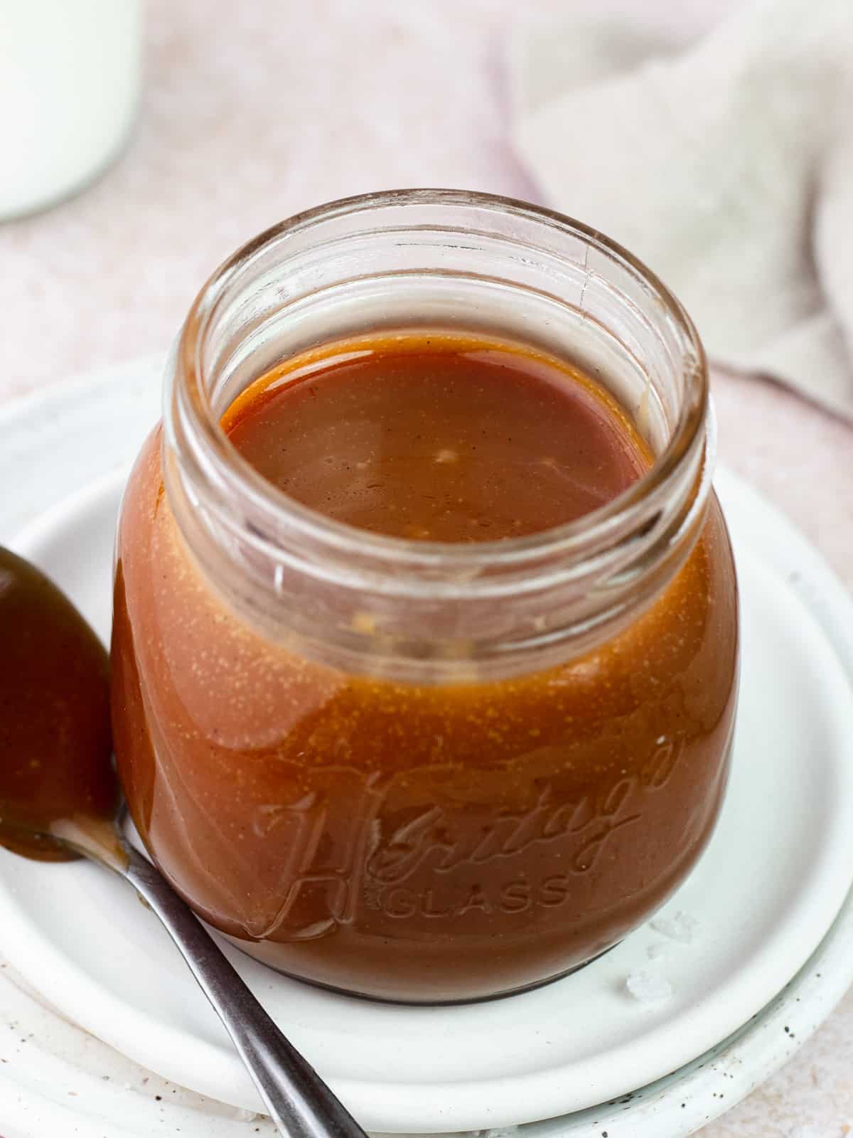 Salted caramel sauce in a glass jar