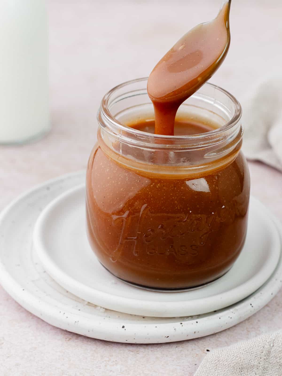 Salted caramel sauce in glass jar