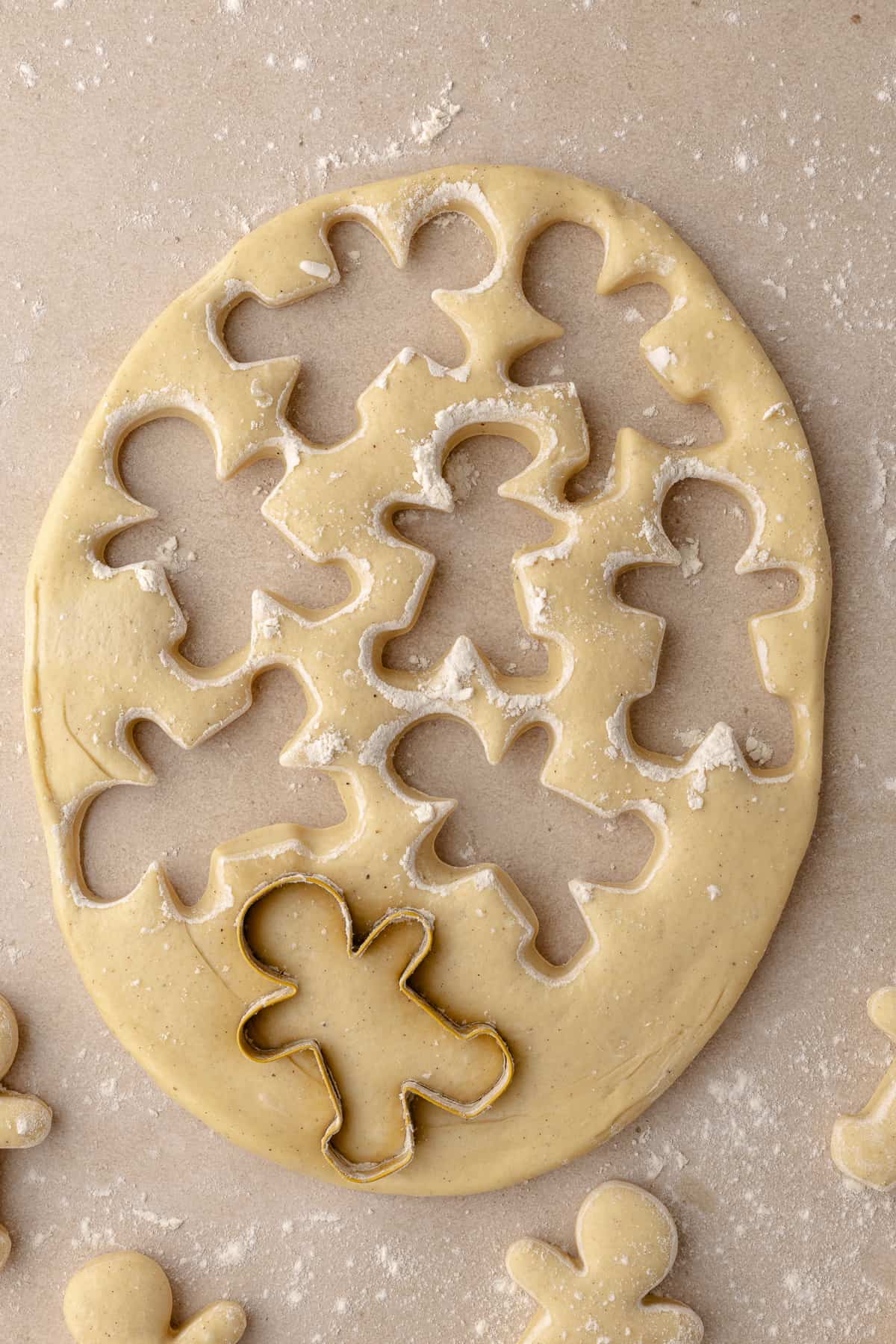 Cutouts of gingerbread man dough