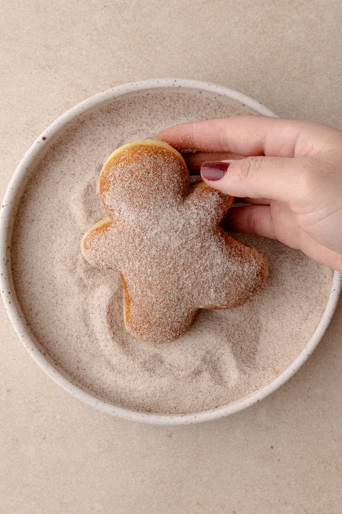 Gingerbread man donut is coated in cinnamon sugar