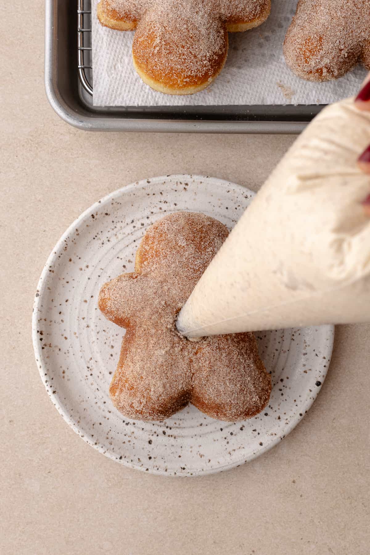 Gingerbread man donut is filled with gingerbread cheesecake filling