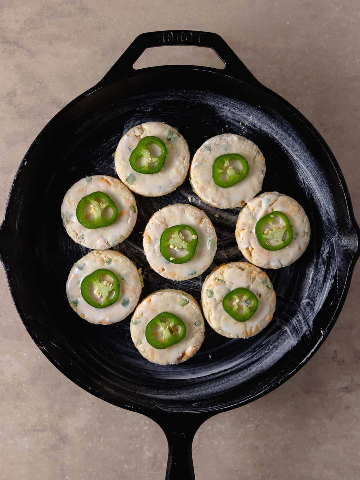 Biscuits before it has baked in a cast iron pan.