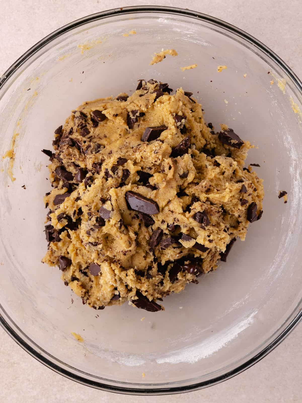 Chopped chocolate and chocolate chips are added and mixed into the cookie dough.