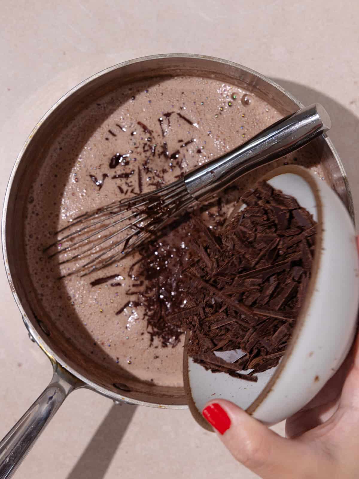 Finely chopped chocolate is added into the custard mixture.