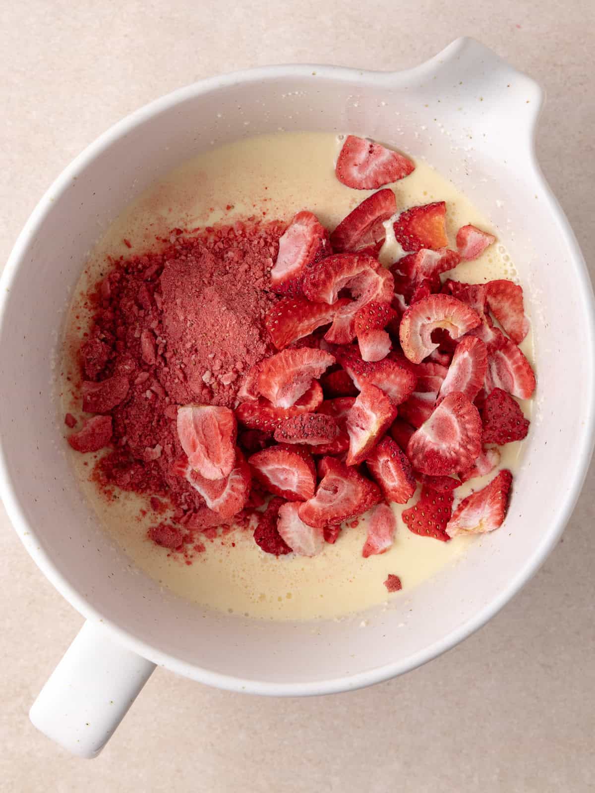 Freeze dried strawberries are added to the custard base.