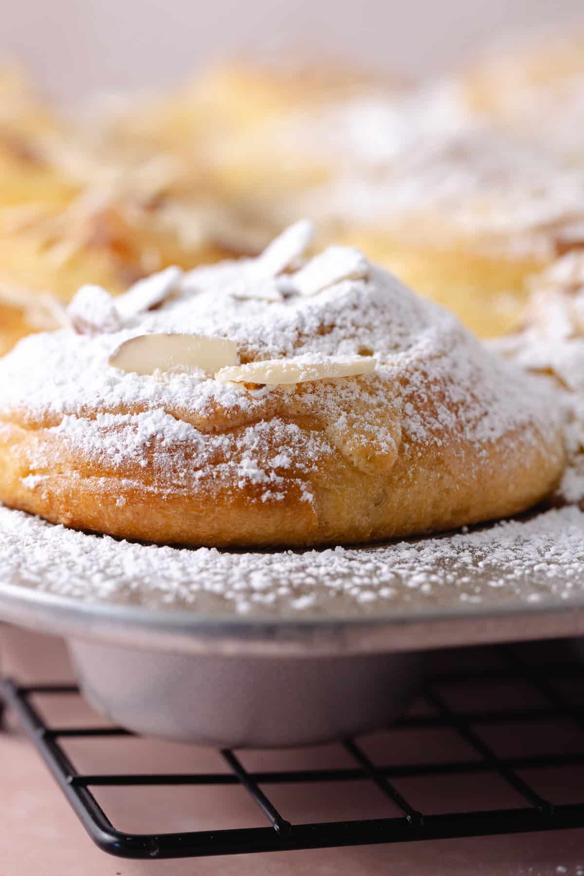 Powdered sugar is added to the tops of the muffins.