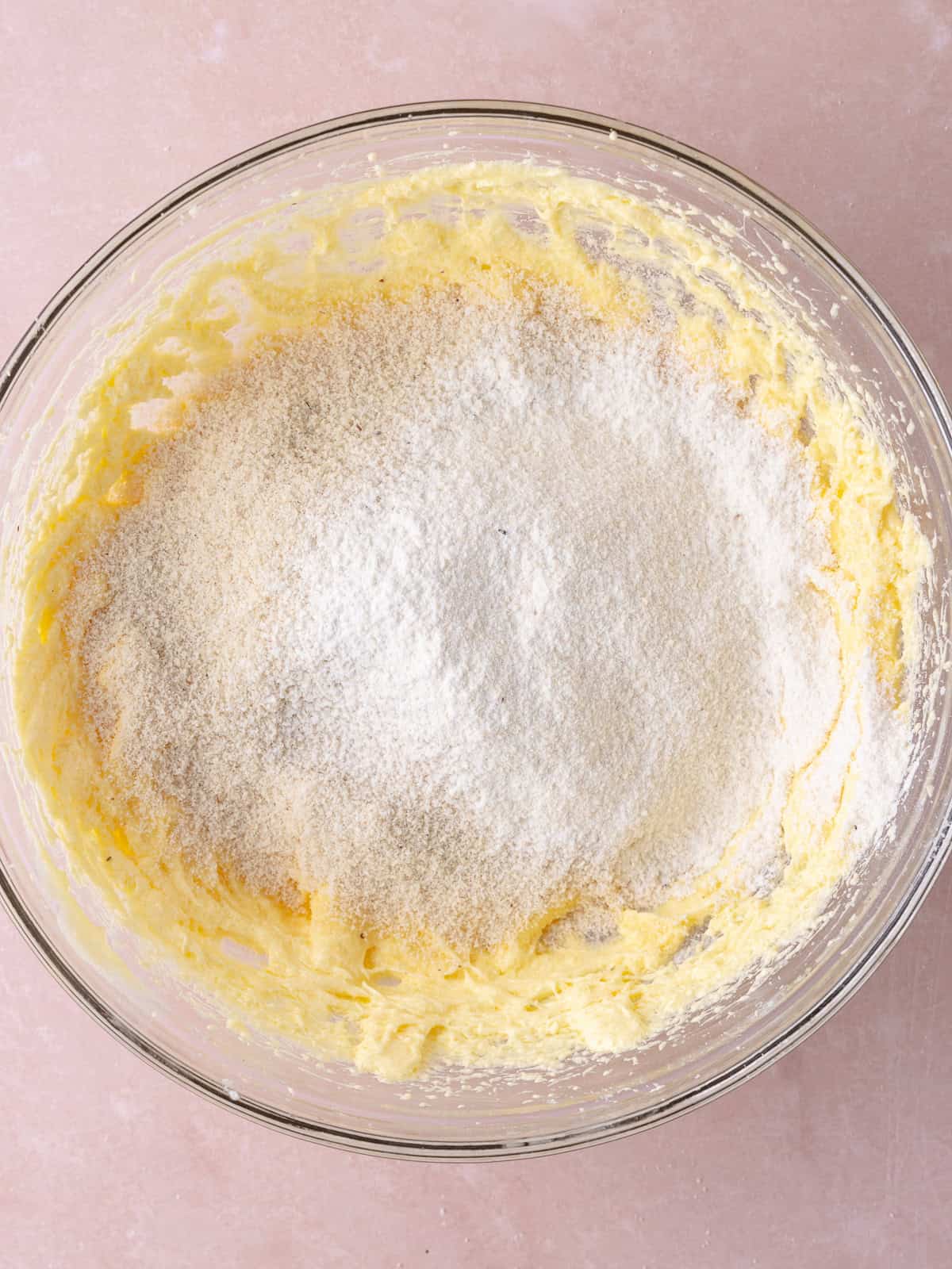 Fine almond flour and all-purpose flour is sifted into the frangipage mixture.