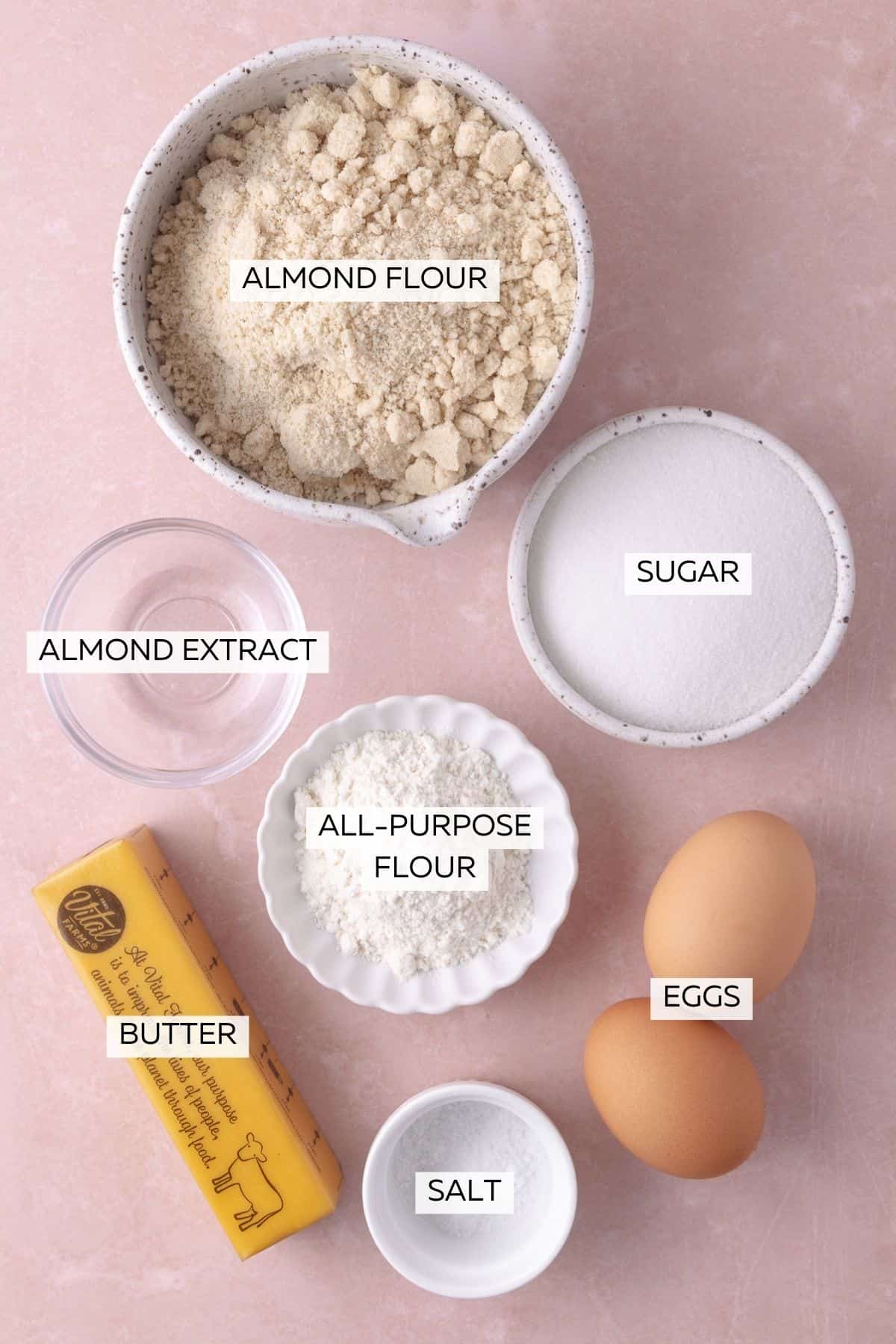 Frangipane ingredients, which include butter, eggs, almond extract, almond flour, all-purpose flour, sugar and salt.