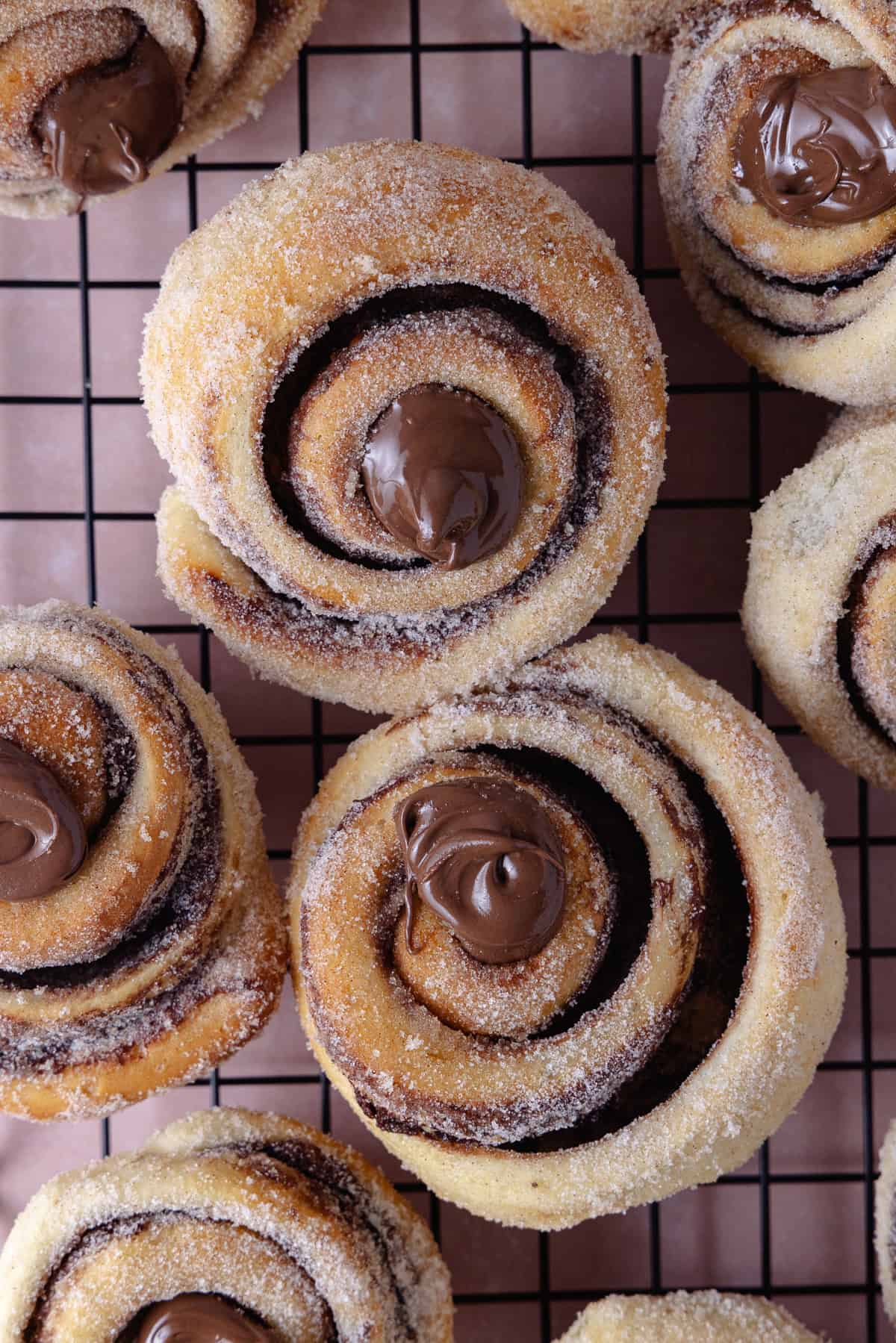 Nutella Cinnamon Rolls on a cooling rack.