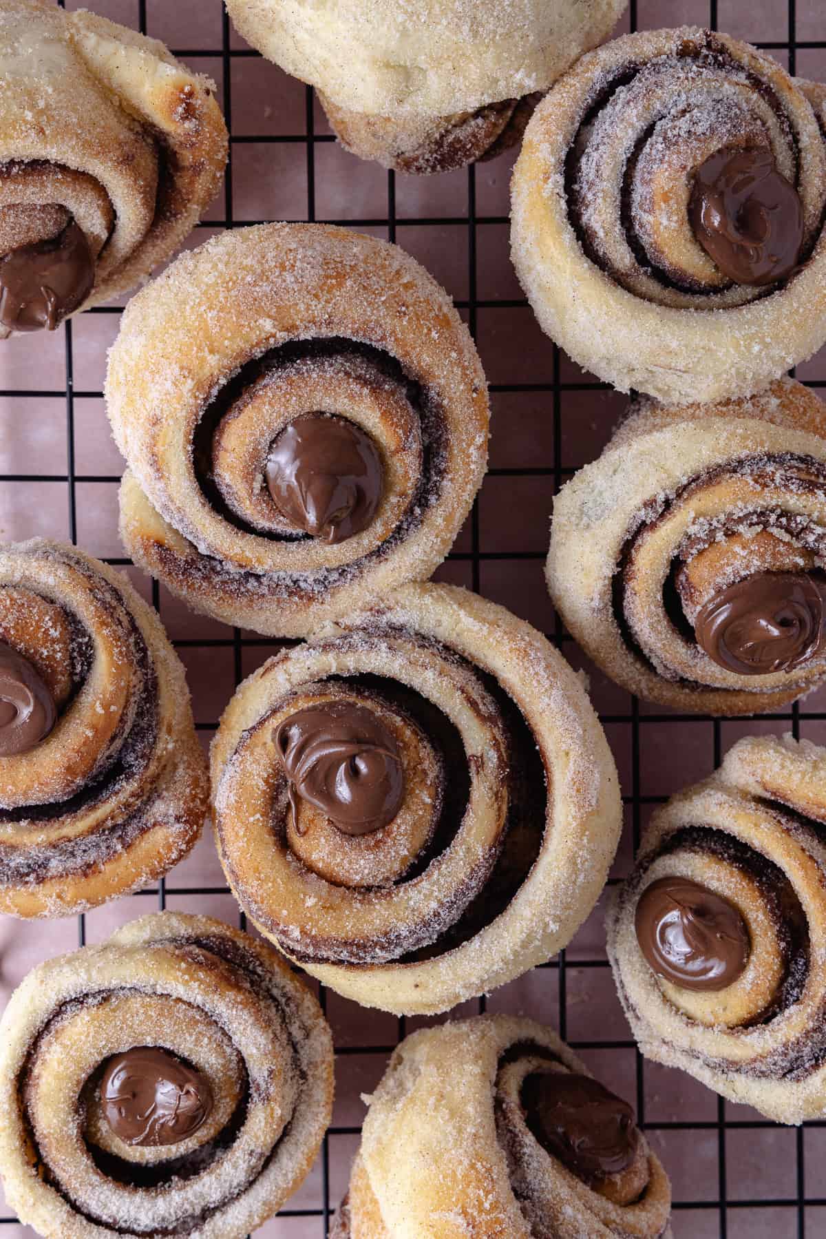 Nutella Cinnamon Rolls on a cooling rack.