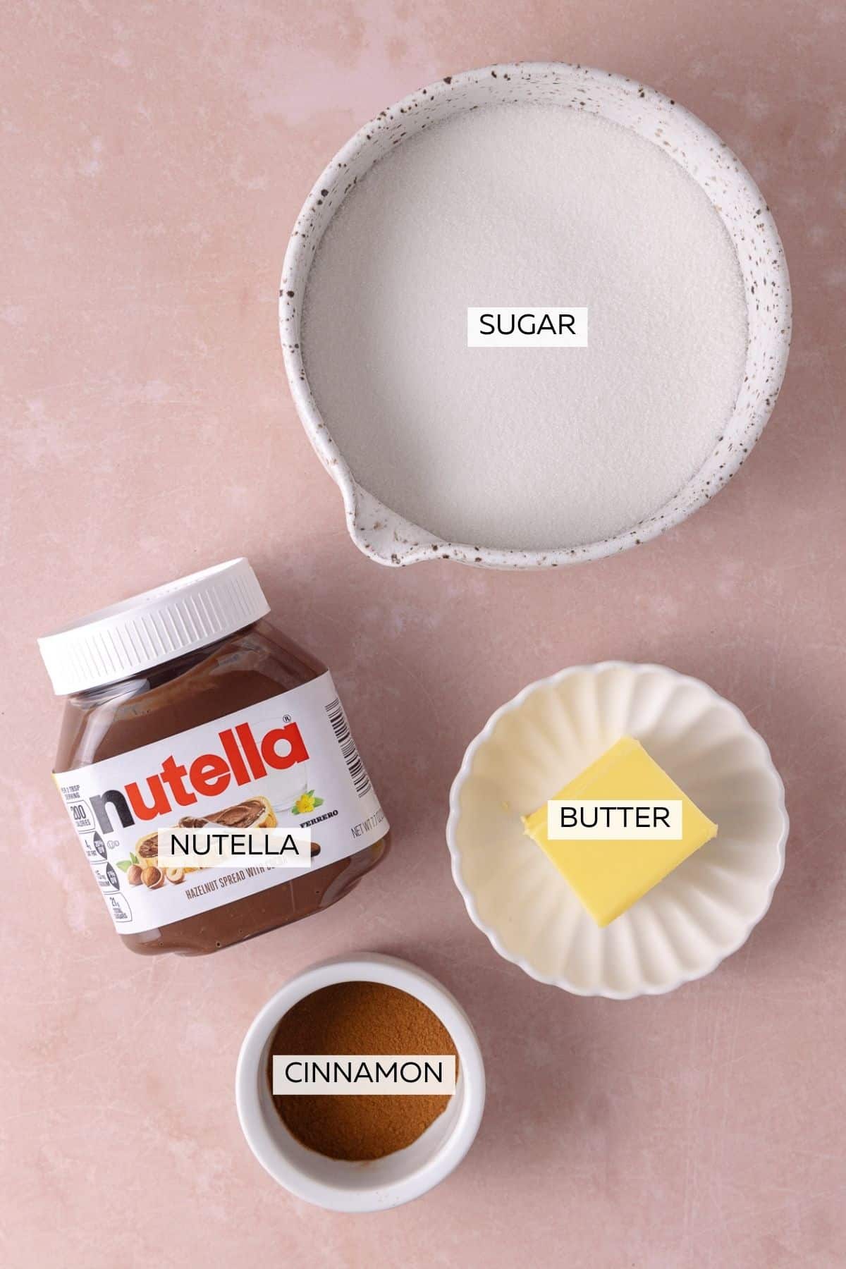 Nutella Cinnamon Rolls filling and coating ingredients, which include Nutella, butter, sugar and cinnamon.