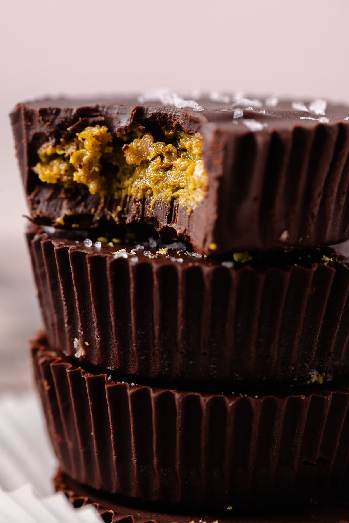 Close up of a stack of pistachio butter cups.