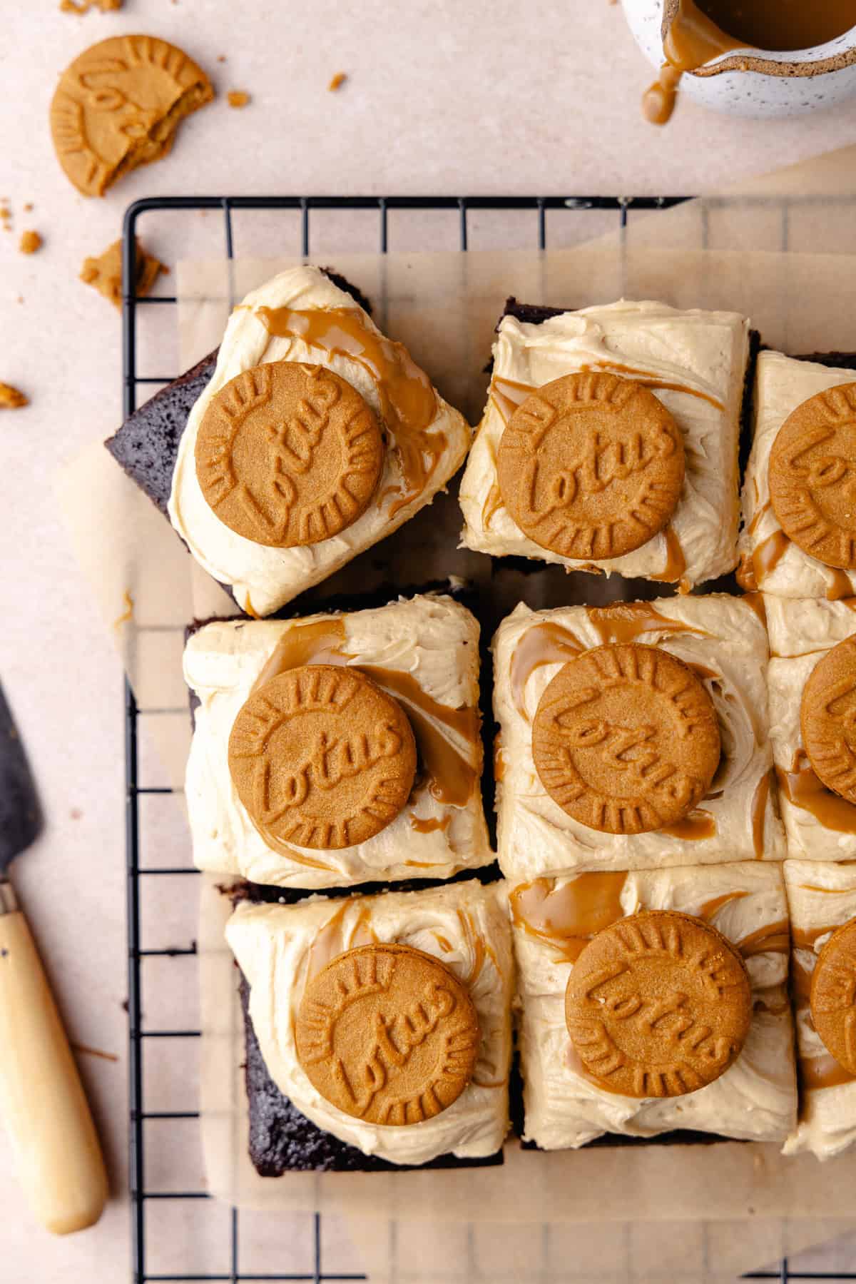 Biscoff chocolate cake slices on a wire rack.