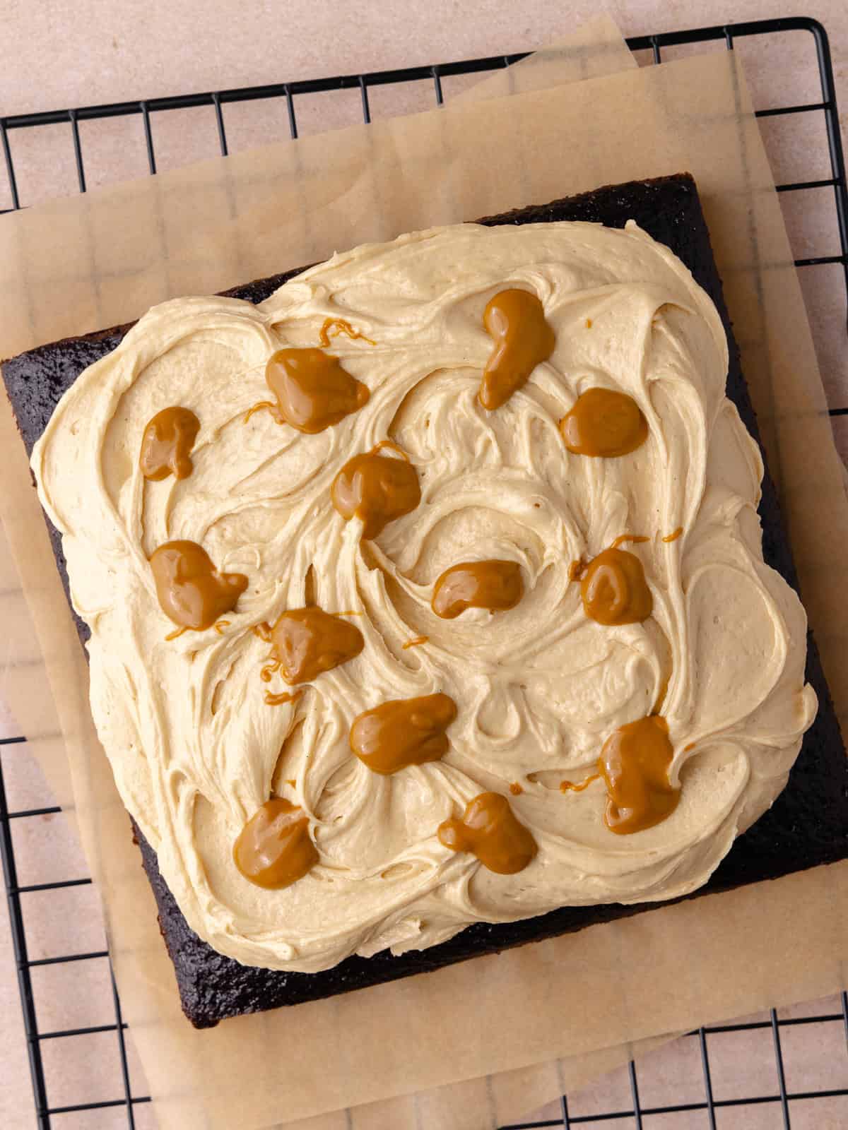 Frosting and melted cookie butter us on top of the cake,