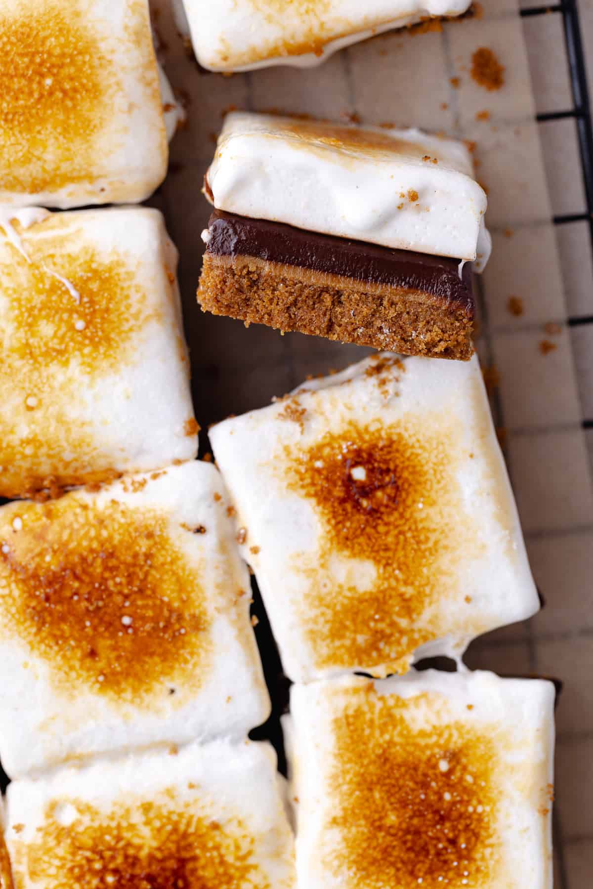 Biscoff S'mores Bars squares on a wire rack.