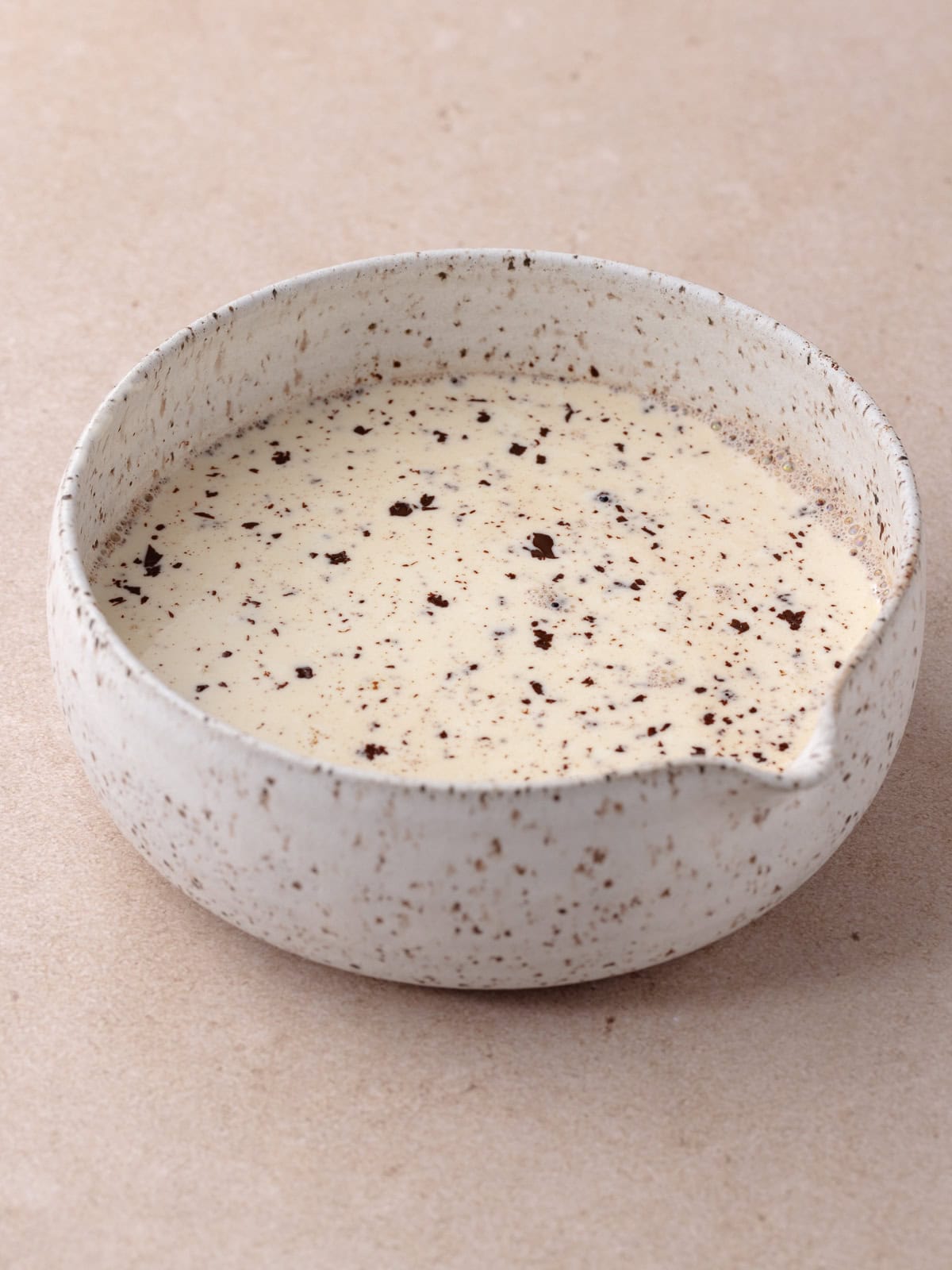 Hot cream is combined with finely chopped chocolate.