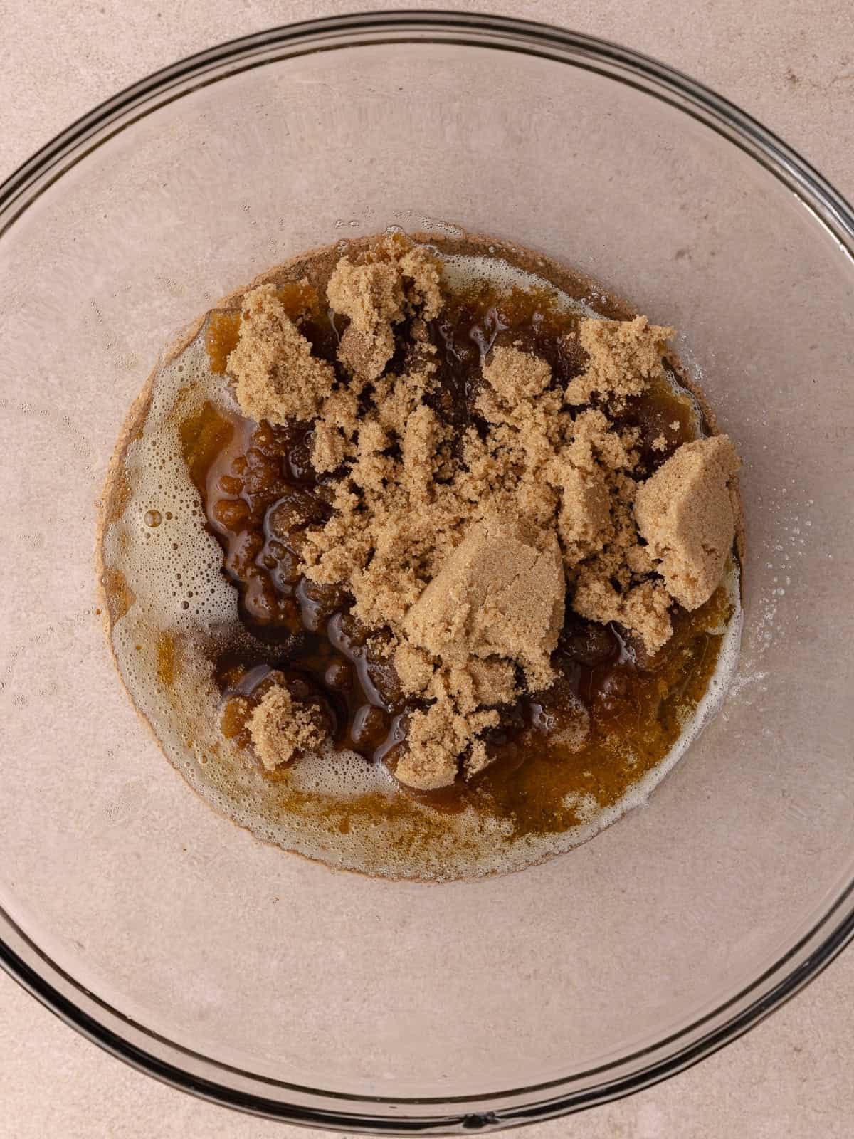 Brown butter and brown sugar ad added to a large mixing bowl.