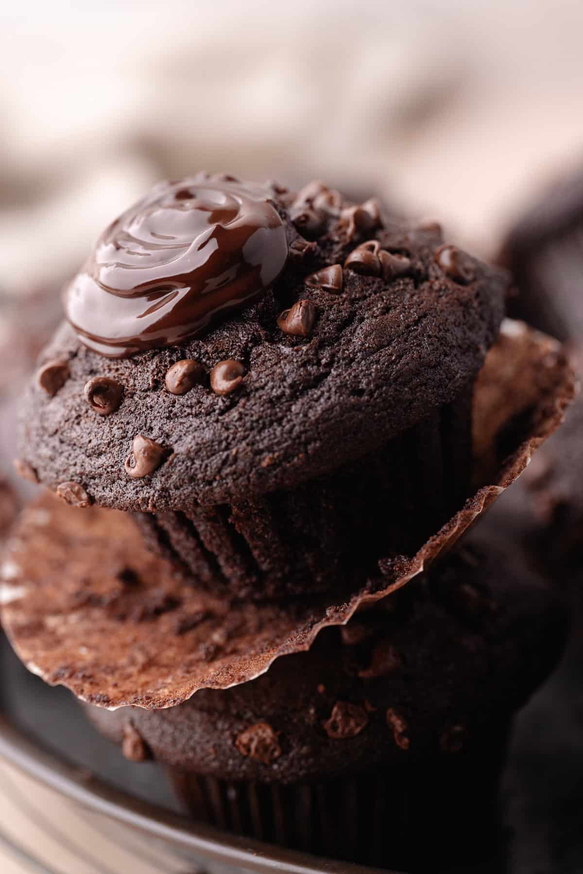 A close up of triple chocolate muffins on serving tray.