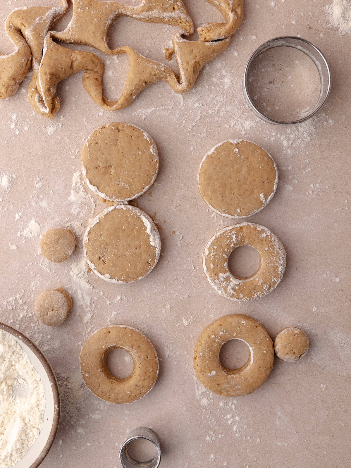 Round donuts are cut out of the dough.