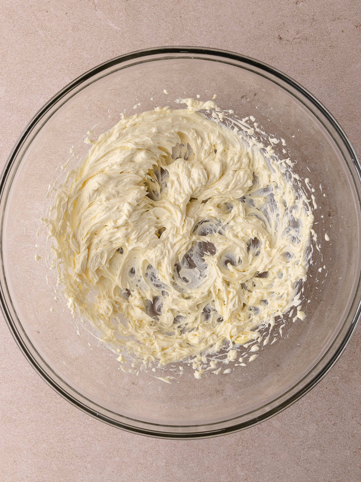 Cream cheese, Softened butter, salt and vanilla are whipped together.