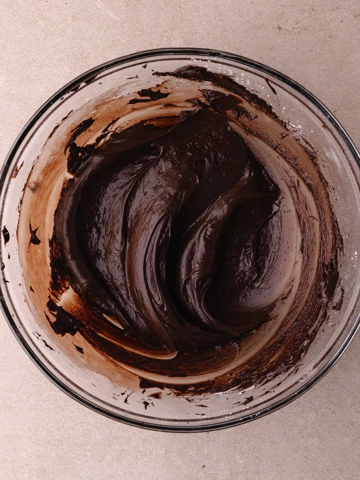 Chocolate frosting in a bowl.