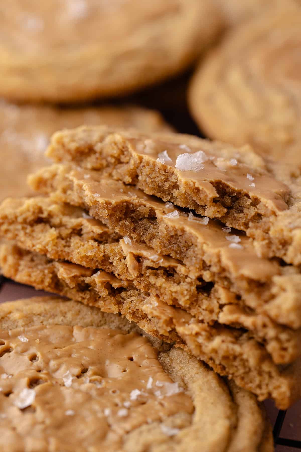 Stack of Brown butter peanut butter cookies on a wire rack.