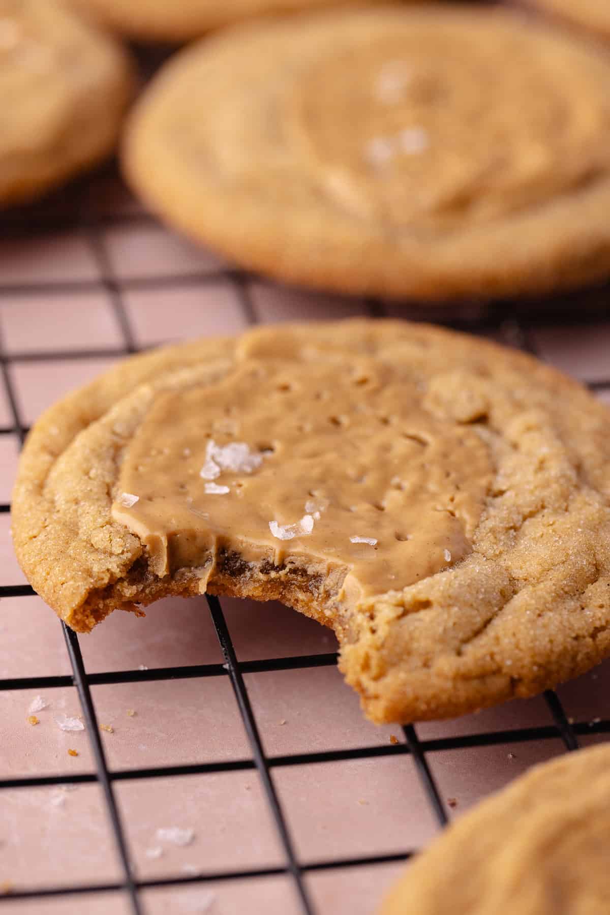 Brown butter peanut butter cookies on a wire rack.