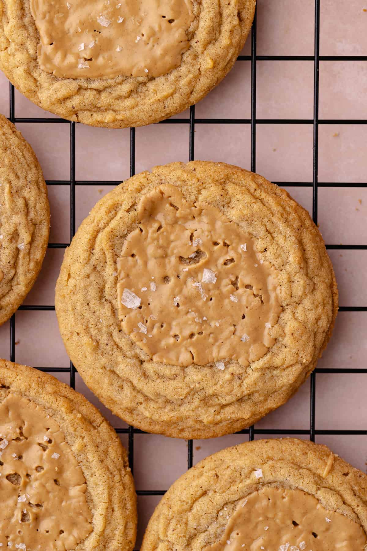 Brown butter peanut butter cookies on a wire rack.