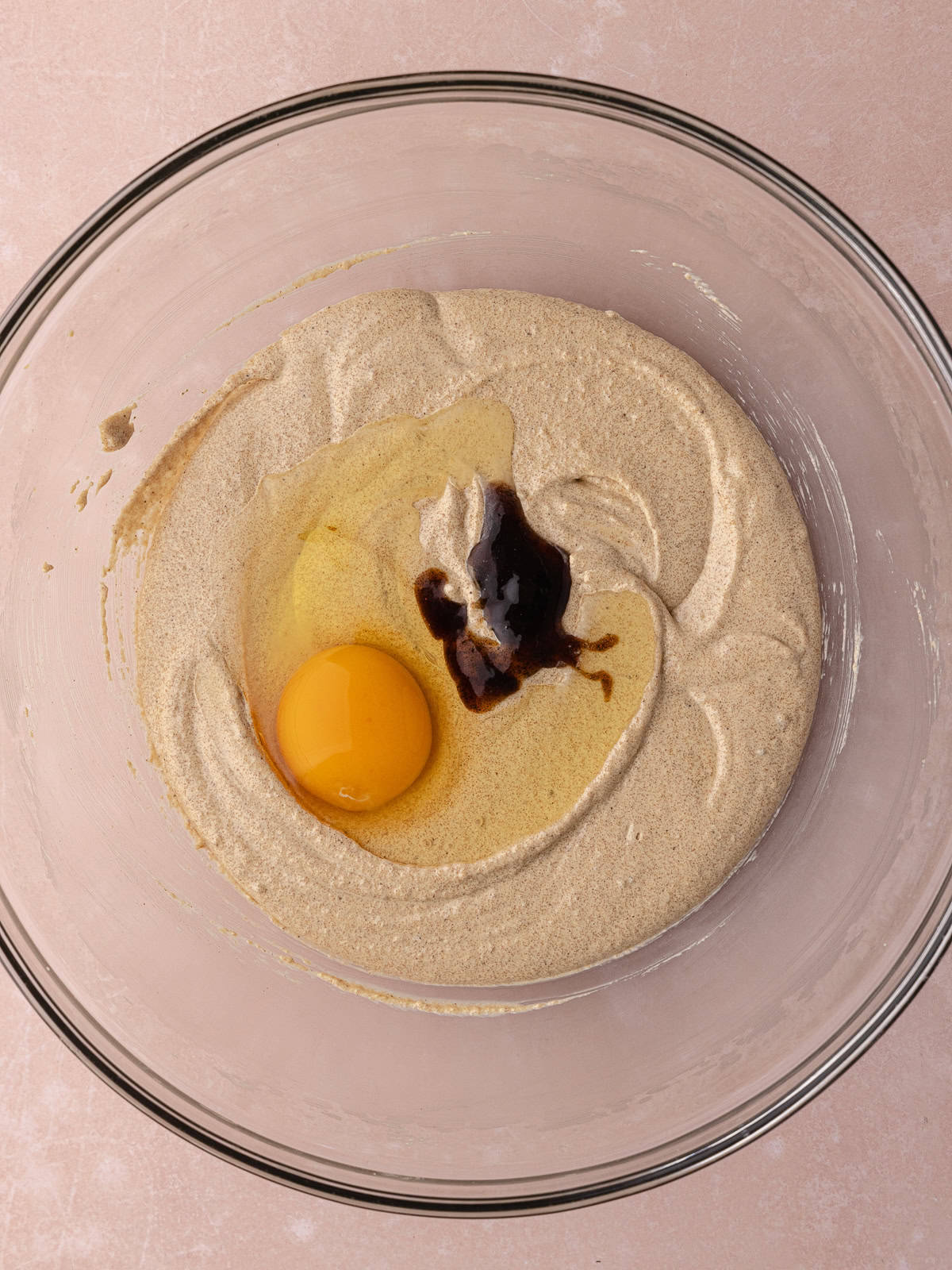 An egg and vanilla pasted is added to the whipped butter and sugar.