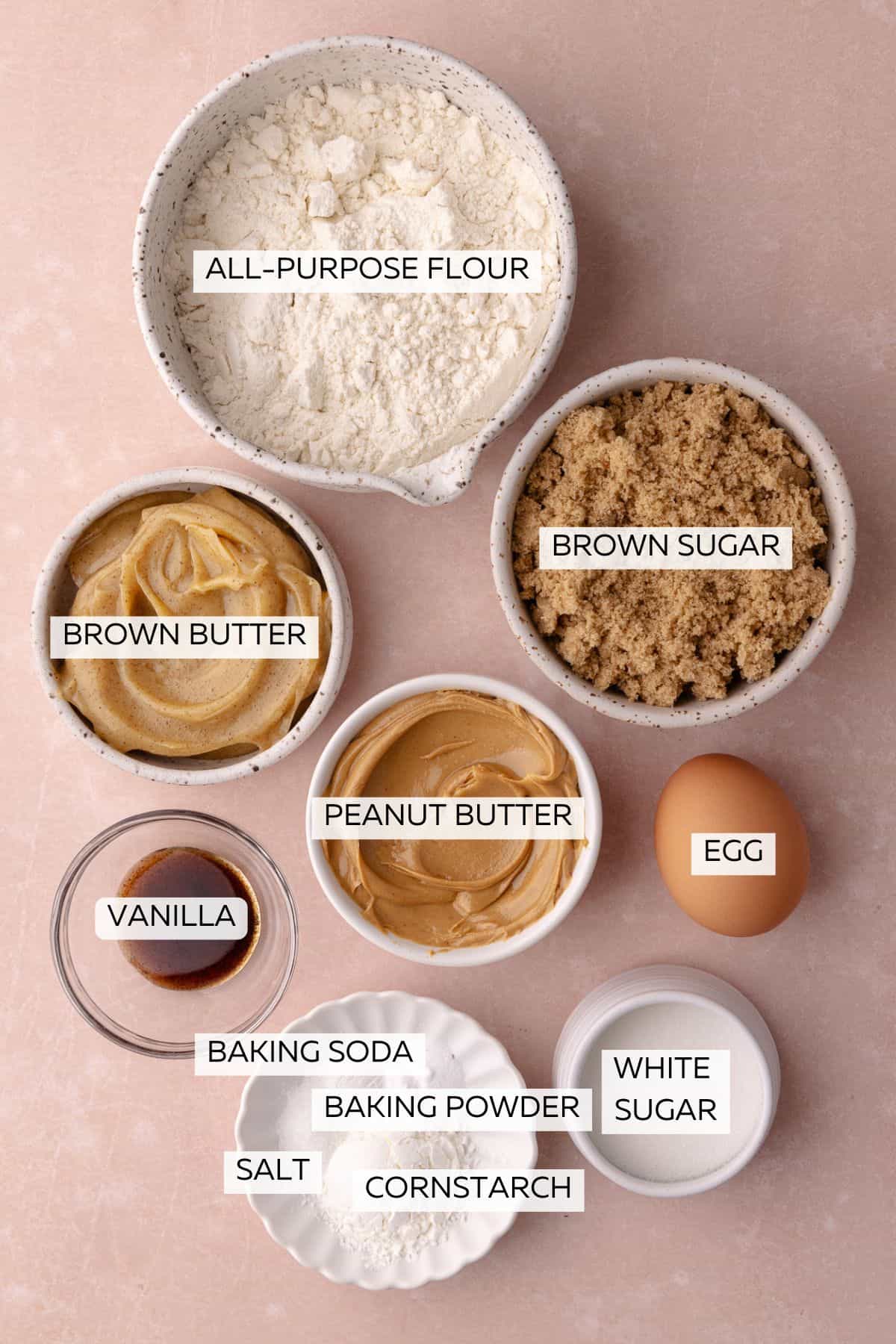 Brown butter peanut butter cookies ingredients which include, flour, brown sugar, white sugar, baking powder, baking soda, egg, salt, vanilla, brown butter and peanut butter.