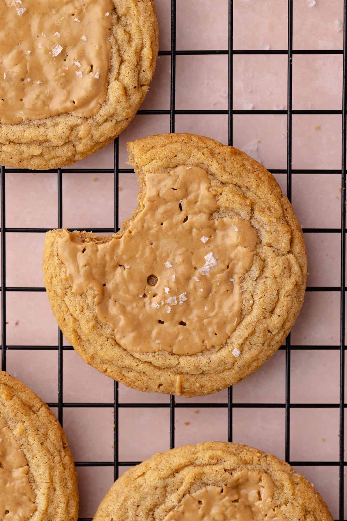 Brown butter peanut butter cookies on a wire rack.