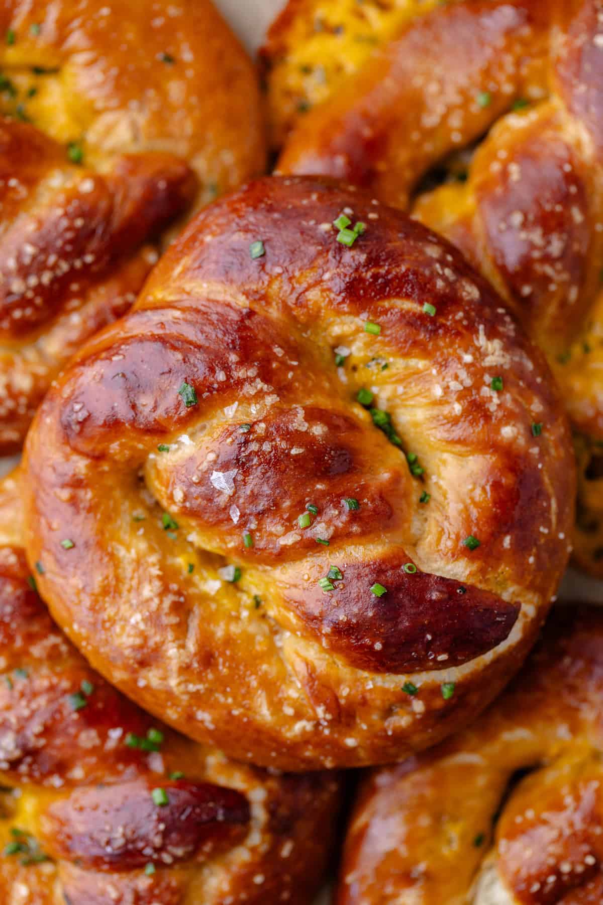 A pile of Cheddar Chive Pretzels.