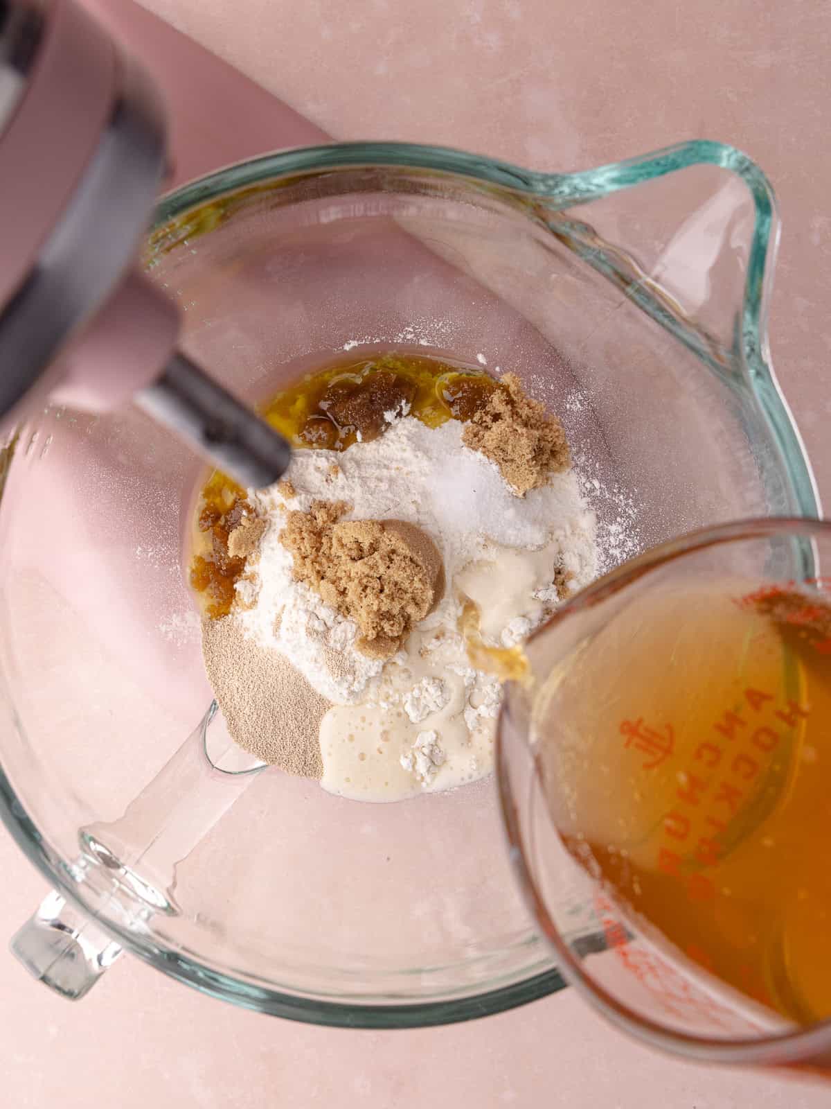 Beer is poured into the dough ingredients.