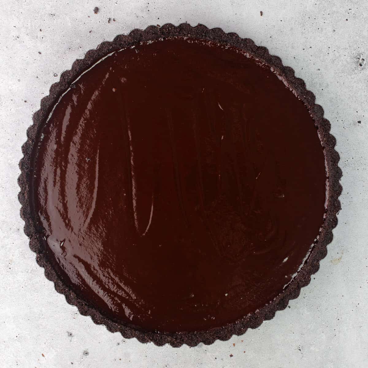 Earl Grey infused chocolate ganache filling is poured over chocolate crust.