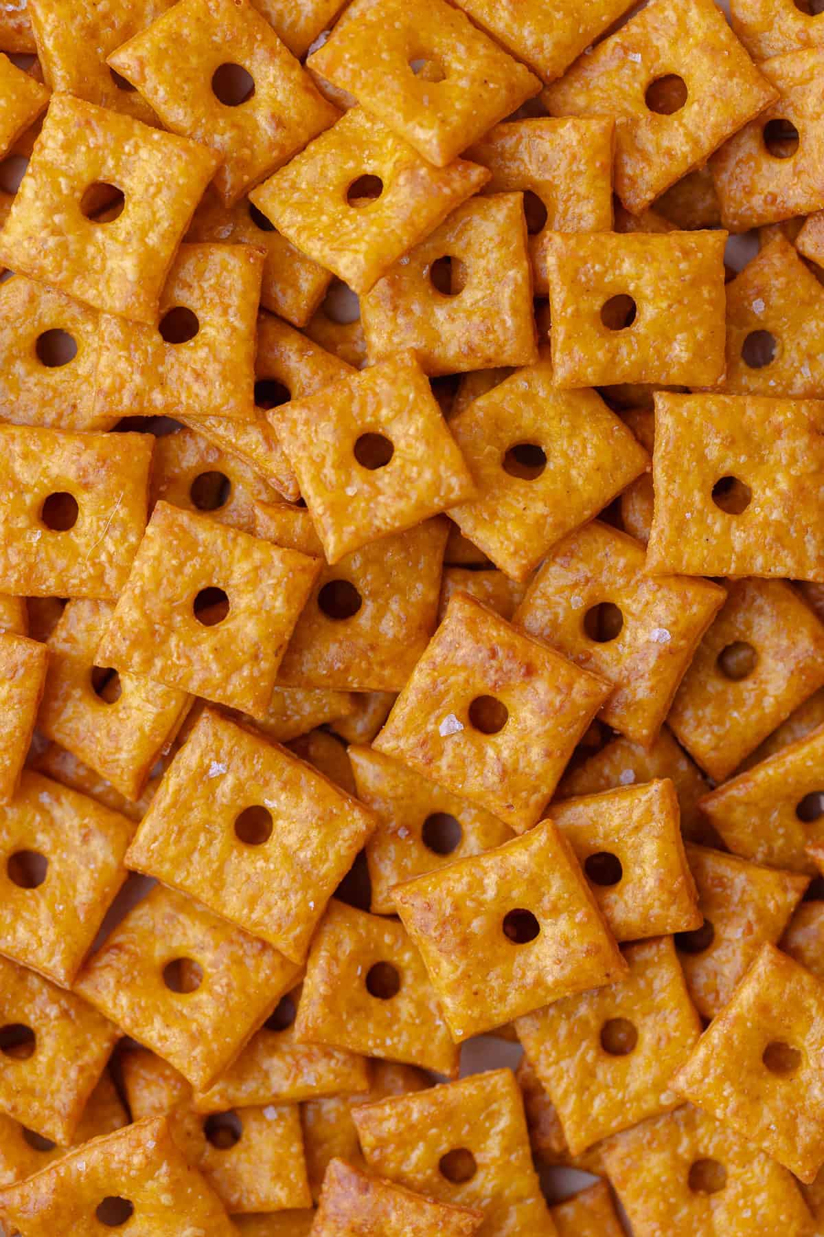 A large pile of pumpkin cheddar crackers.