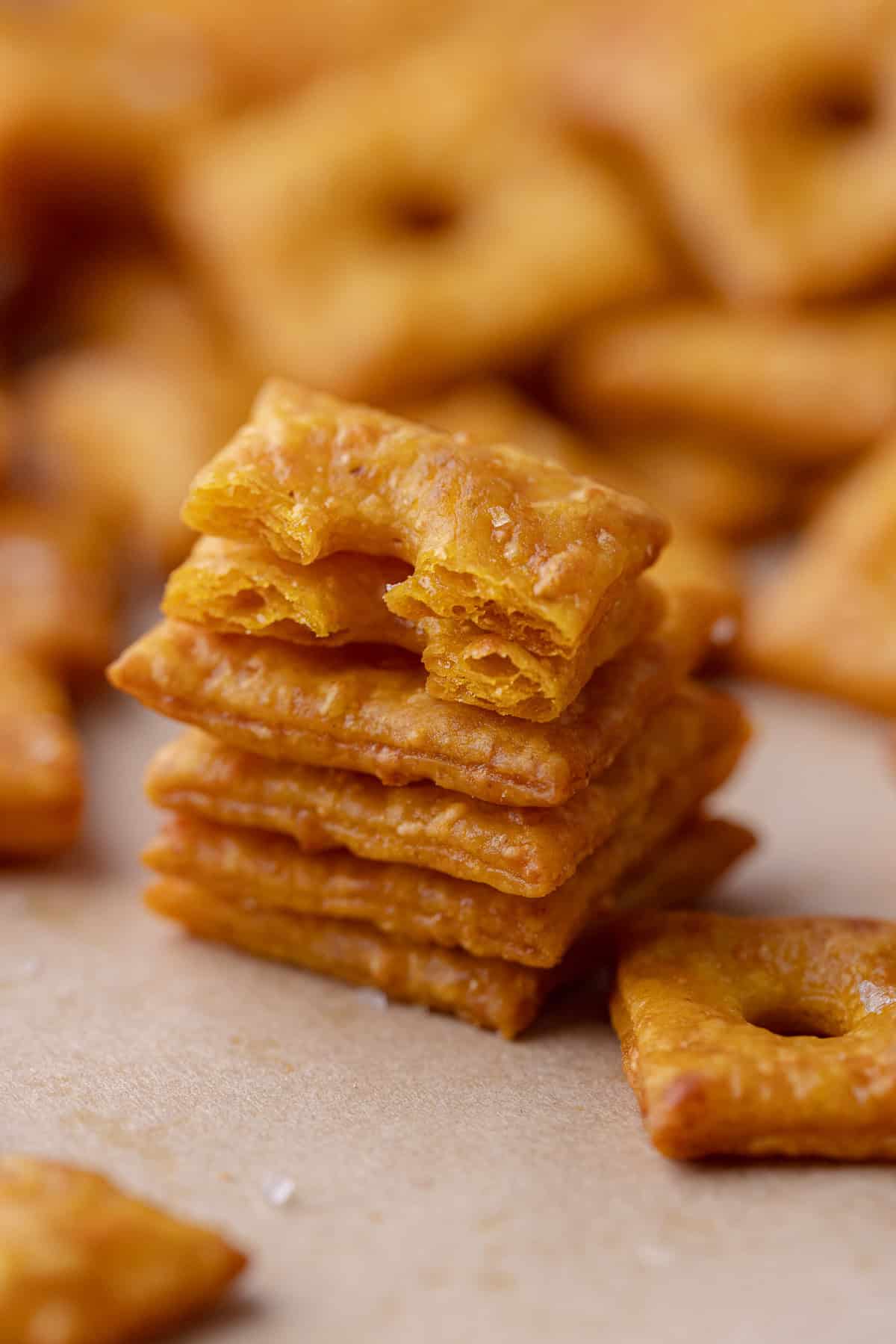 A close up of a stack of pumpkin cheese crackers.