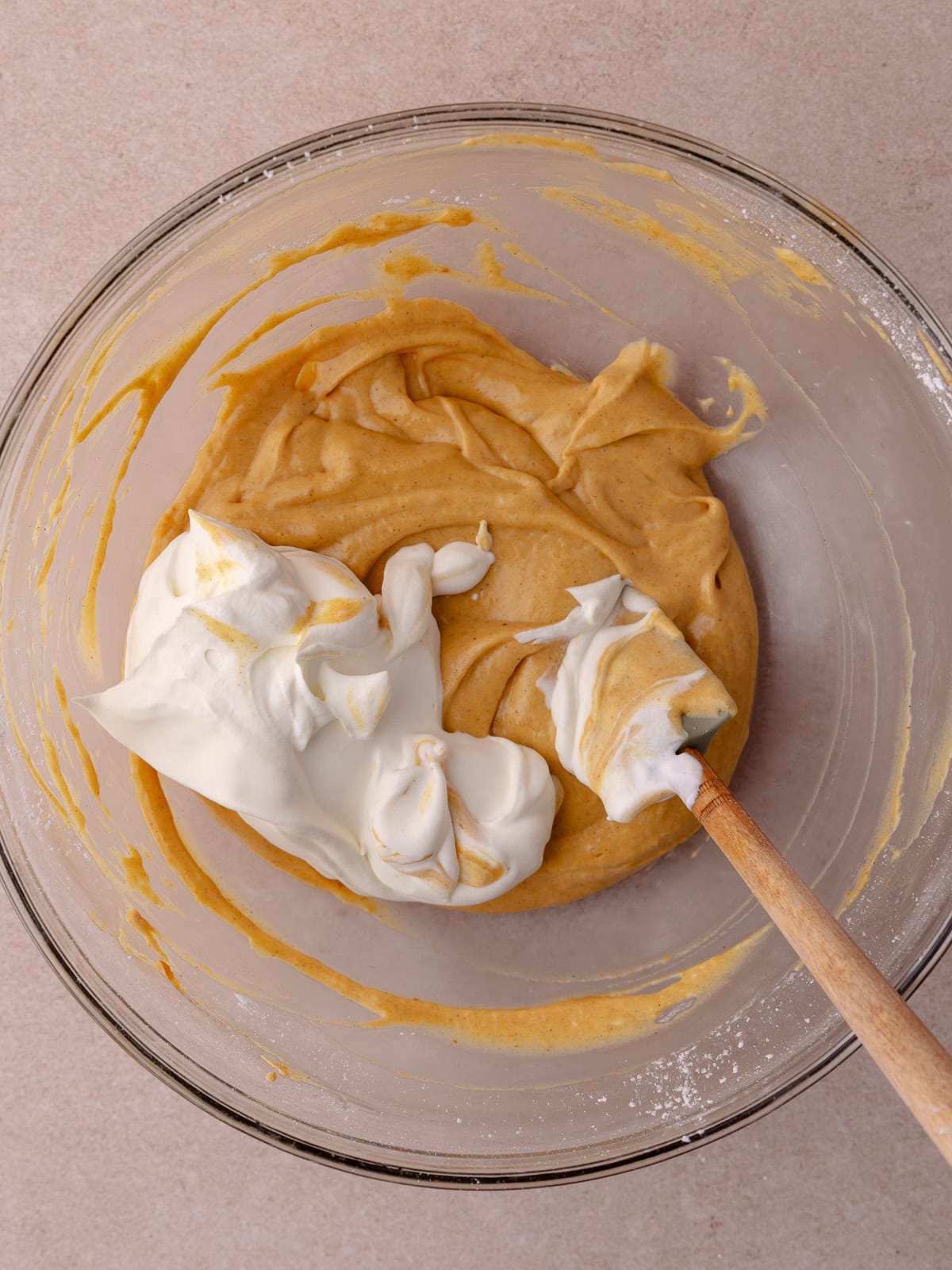 Whipped cream is combined with the pumpkin cheesecake filling.