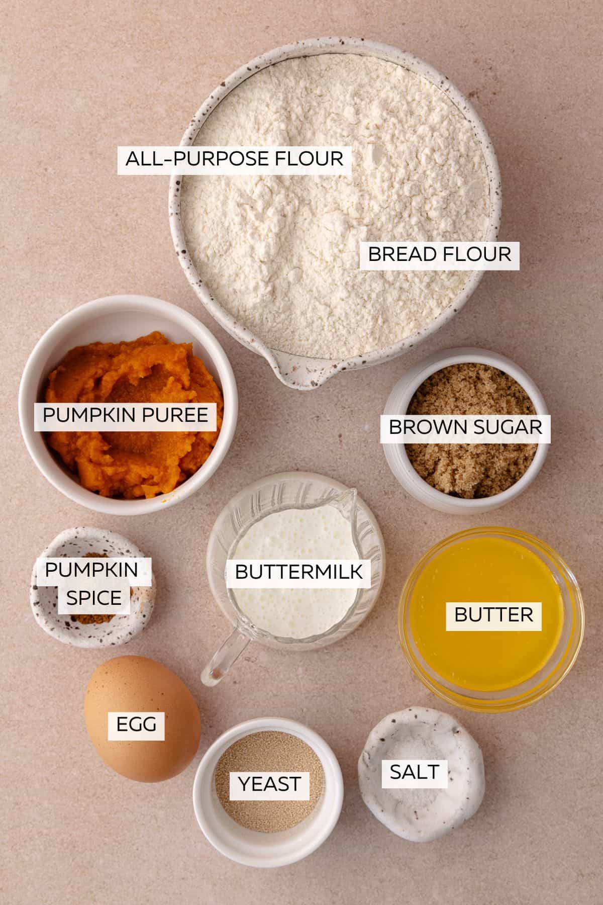 Pumpkin Donut Dough ingredients which include, all-purpose flour, bread flour, yeast, brown sugar, egg, buttermilk, butter, pumpkin pie spice and salt.