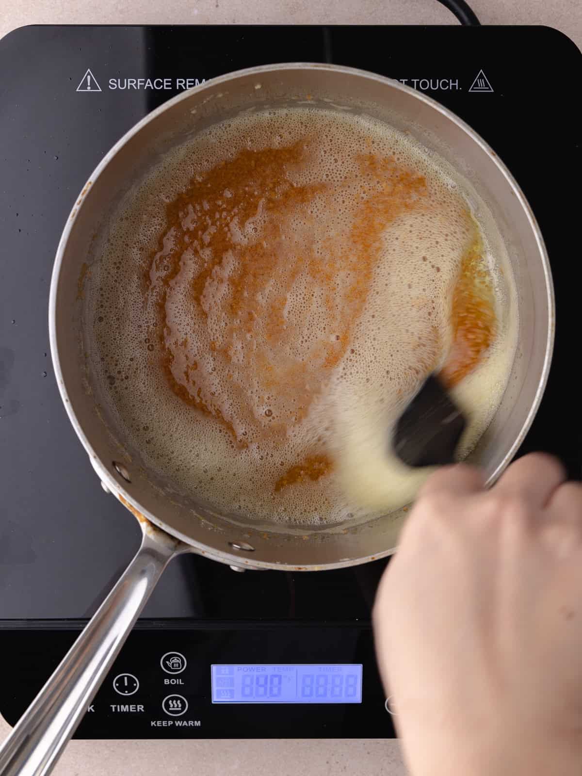 A pot of brown butter and toasted milk powder.