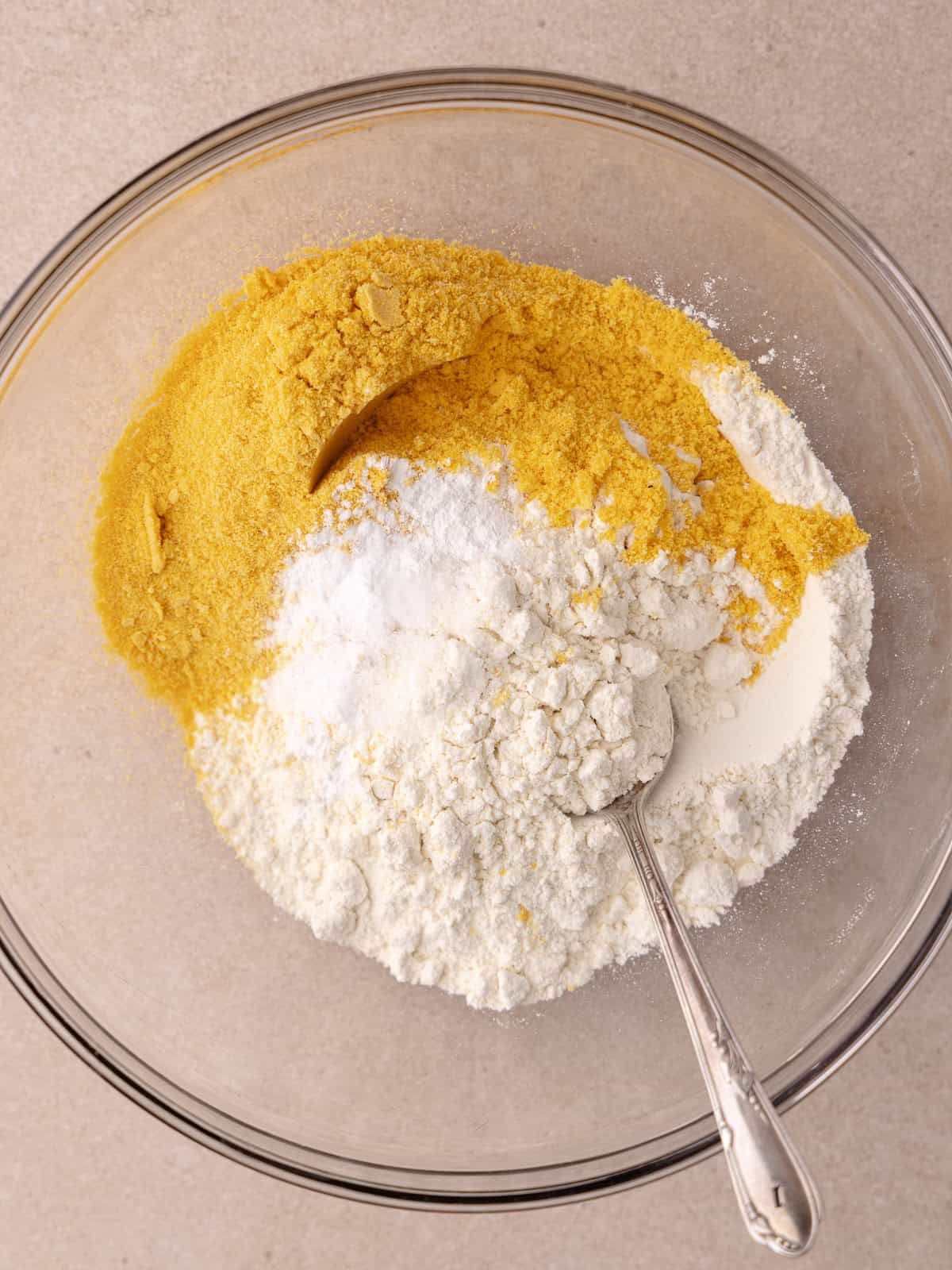 All-purpose flour, finely ground cap'n crunch cereal, baking soda, baking powder and salt are in small mixing bowl.