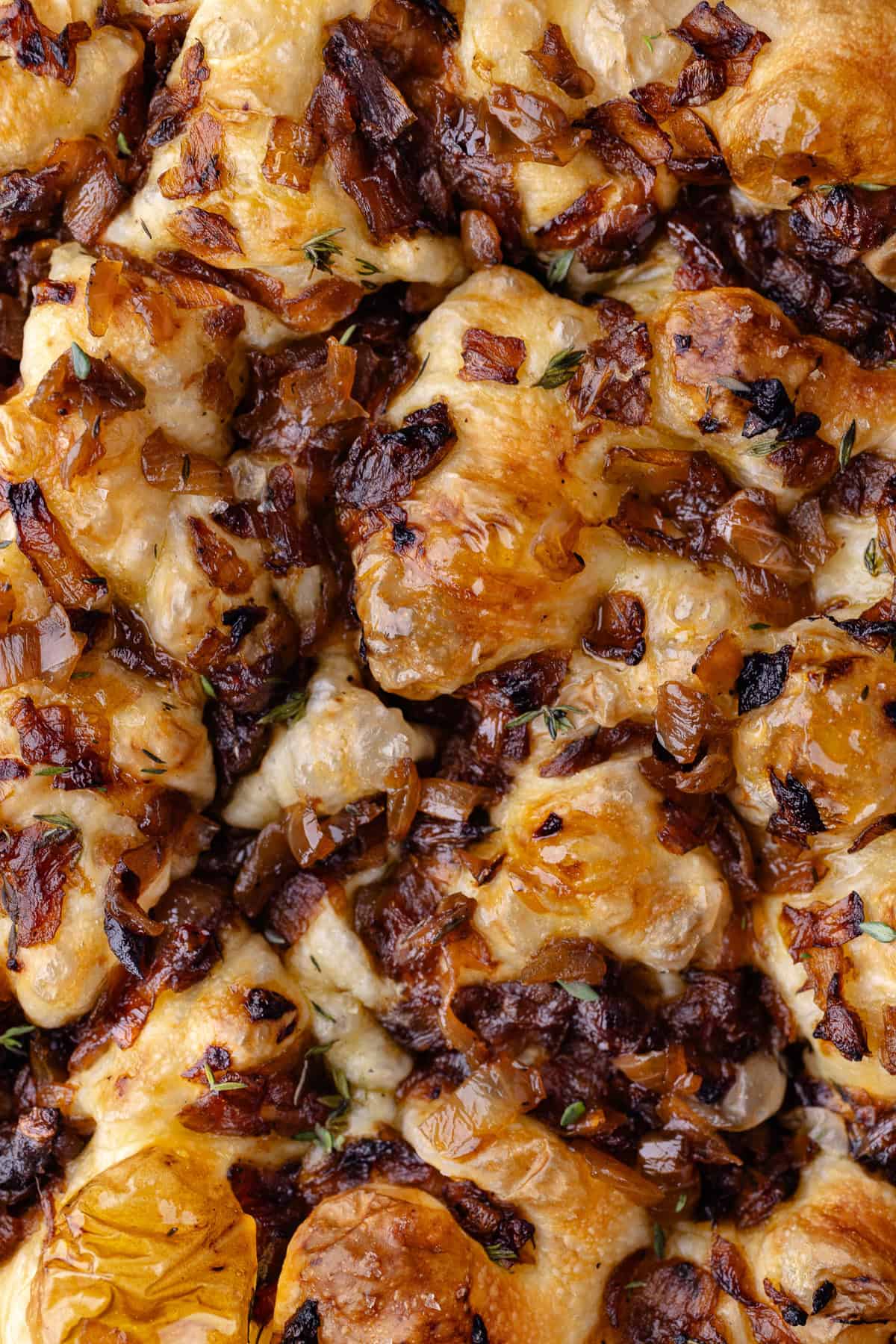 A close up of the top of the overnight caramelized onion focaccia.