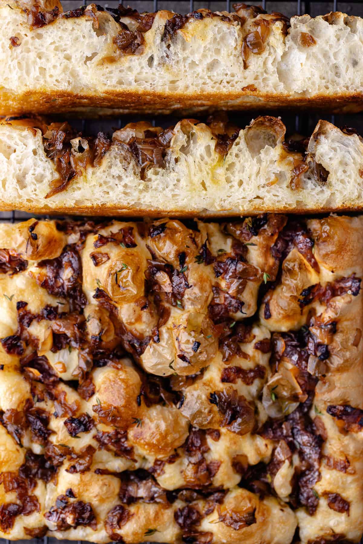 Overnight Caramelized onion focaccia on a wire rack and cut into strips.